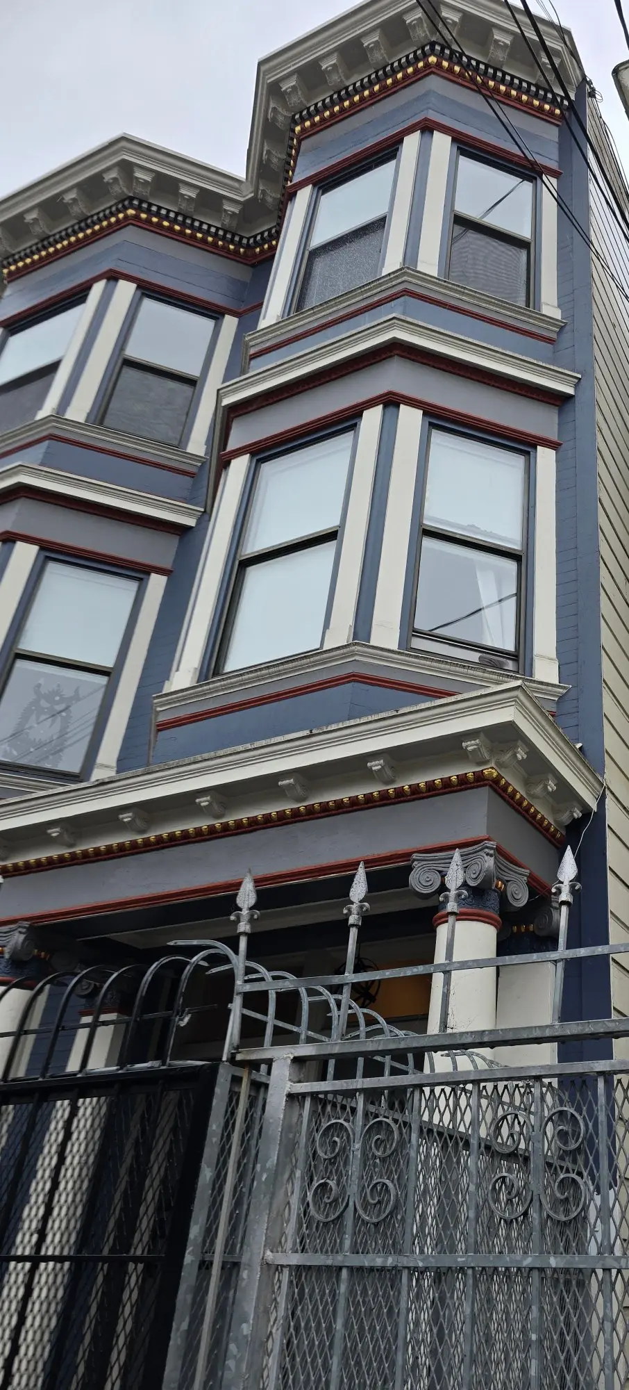 Exterior view of a classic Victorian-style house with bay windows.