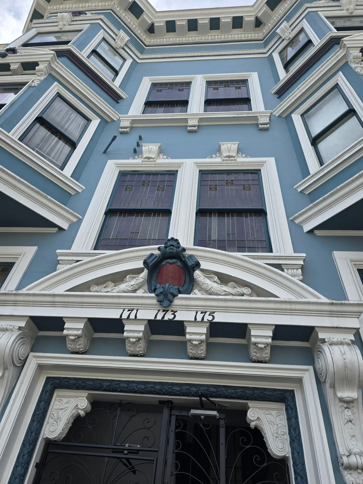 Facade of an ornate historic building with detailed architectural elements.