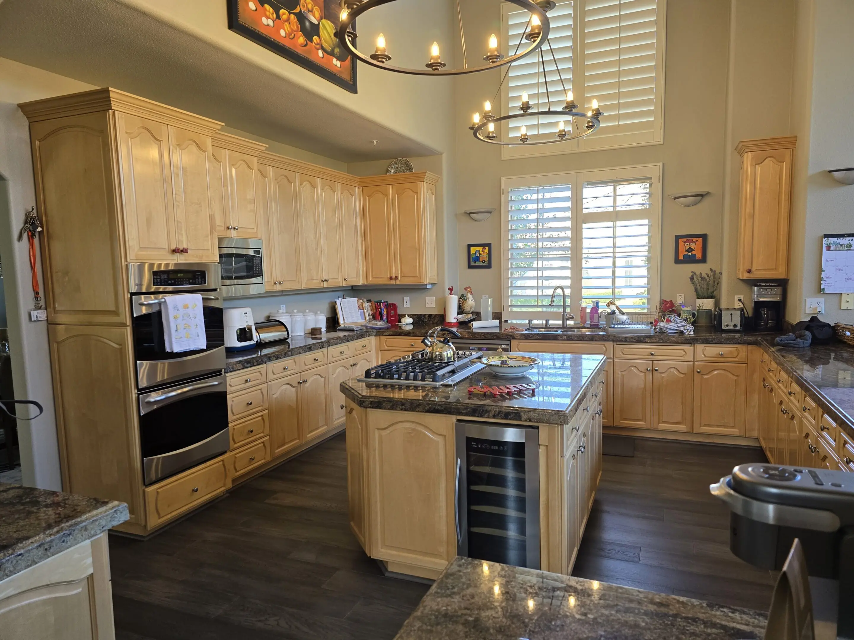 Spacious kitchen with wooden cabinets and modern appliances.